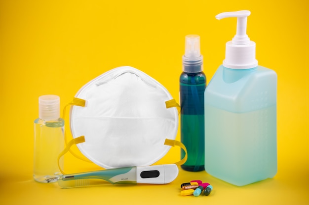 Medical hygiene products on yellow table