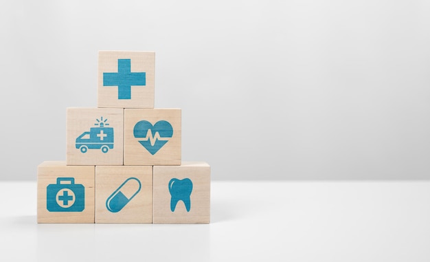 Medical icon on pyramid of cubes. medicine and health insurance concepts. Health insurance banner or backdrop concept. grey background, copy space