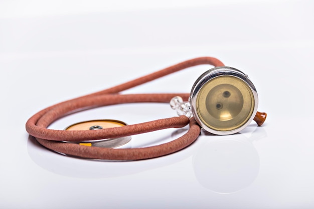 Medical Instrument vintage antique stethoscope isolated on white background