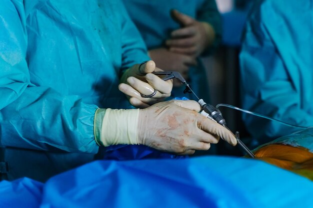 Medical instruments in surgeon's hands Operating process in hospital Doctors performing operation with surgery tools