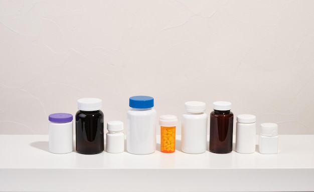 Medical jars with various pills to treat illnesses Copy space for text