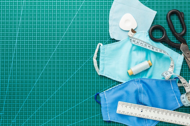 medical masks with scissors and measuring tape