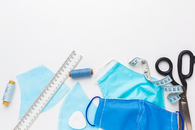 Photo medical masks with scissors and thread