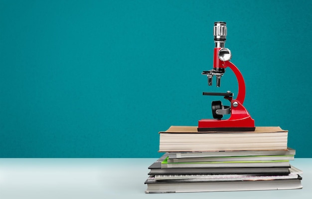 Medical microscope and books on  table