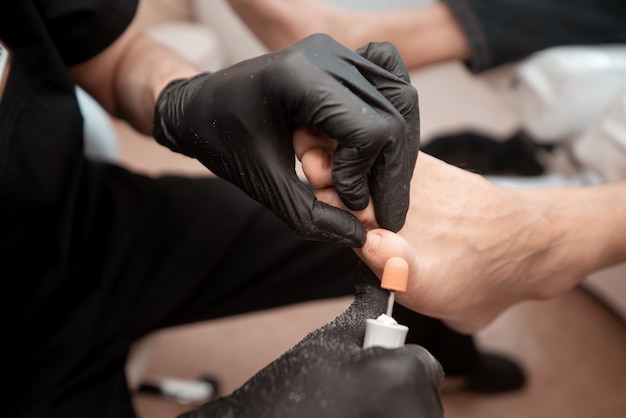 Foto studio medico, podologia, trattamento dei problemi ai piedi, medico e paziente, stile di vita sano