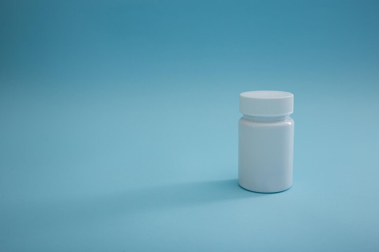 Medical packaging of pills on a blue background a cure for the disease