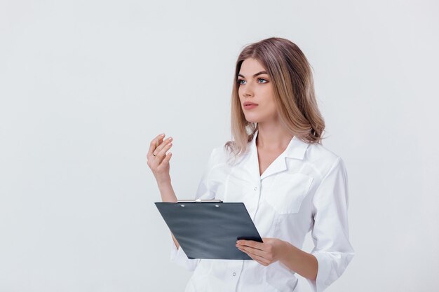 Medical physician doctor woman in white coat holds folder