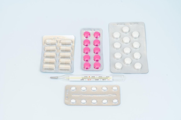 Medical pills and capsules in a blister pack isolated on white background