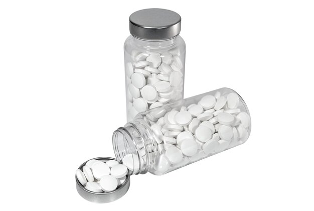 Фото Медицинские таблетки в прозрачных контейнерах на белом фоне