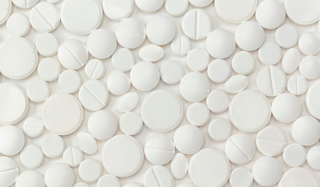 Medical pills various shapes on a white background