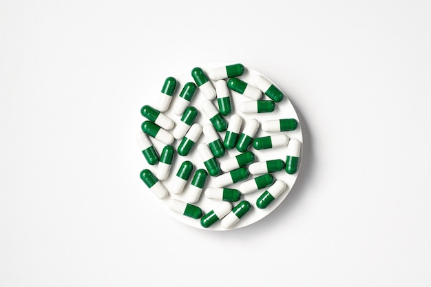 Medical pills on white background with copy space