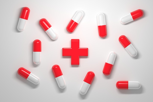 Medical pills with red and white caps and a red big medical cross in the center on white 