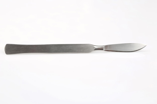 Medical scalpel on a white table
