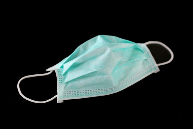 Medical shielding bandage mask isolated on black background