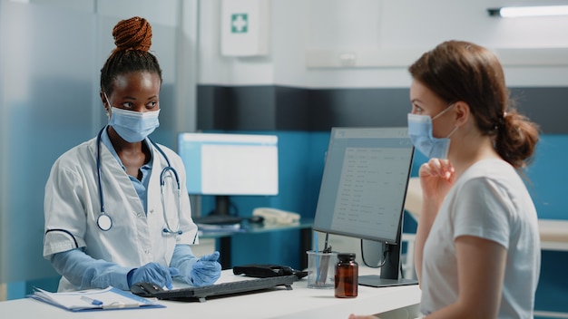 Medical specialist discussing healing treatment with ill woman