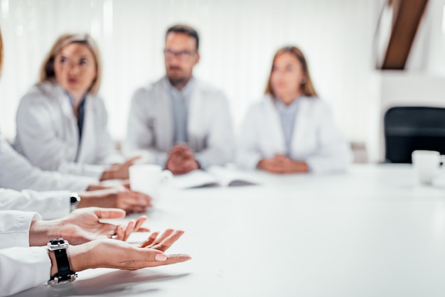 Medical staff discussing at the table. Copy space.