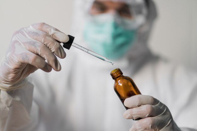 Medical staff  dropping medicine with wearing ppe