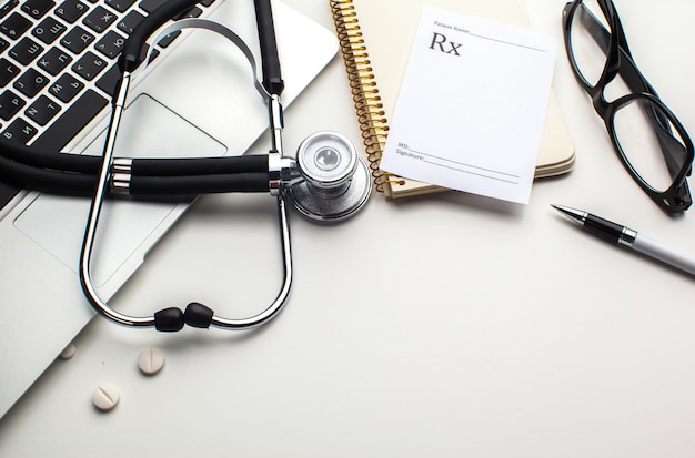 Medical stethoscope on computer keyboard 