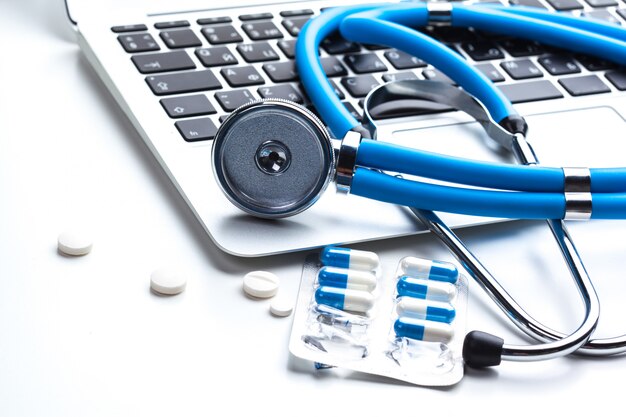 Medical stethoscope on computer keyboard