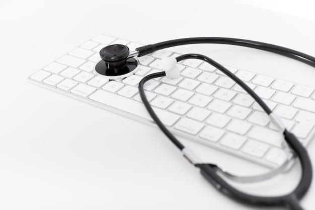 Medical stethoscope, keyboard on the desktop doctor