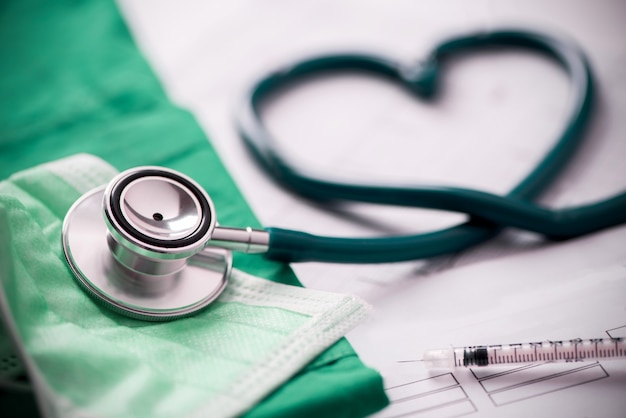 Medical stethoscope twisted in heart shape. Close up