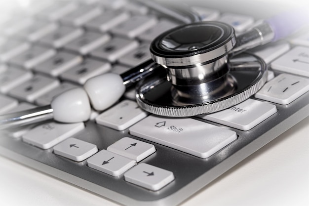 Photo medical stethoscope on a white computer keyboard