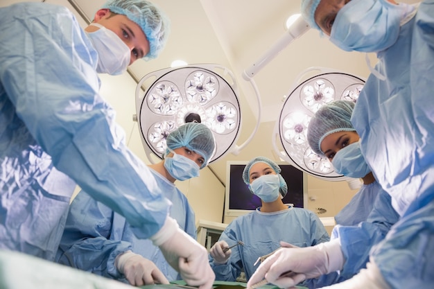 Medical students practicing surgery on model at the university