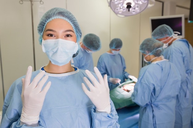 Medical students practicing surgery on model