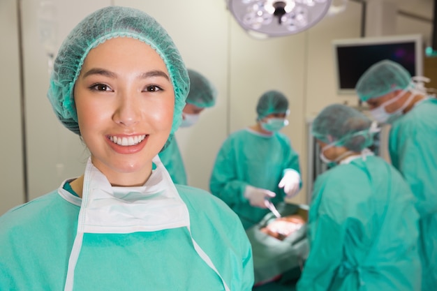 Medical students practicing surgery on model