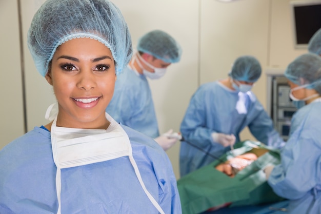 Medical students practicing surgery on model