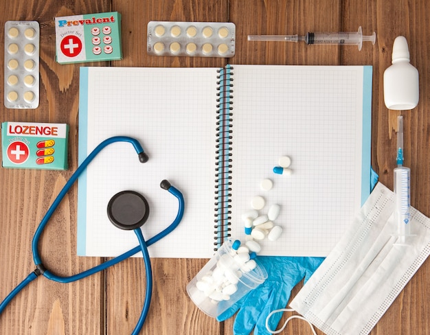 Medical supplies and an open notebook