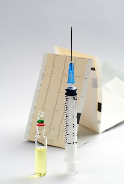 Photo medical syringe and ampoule with medicine