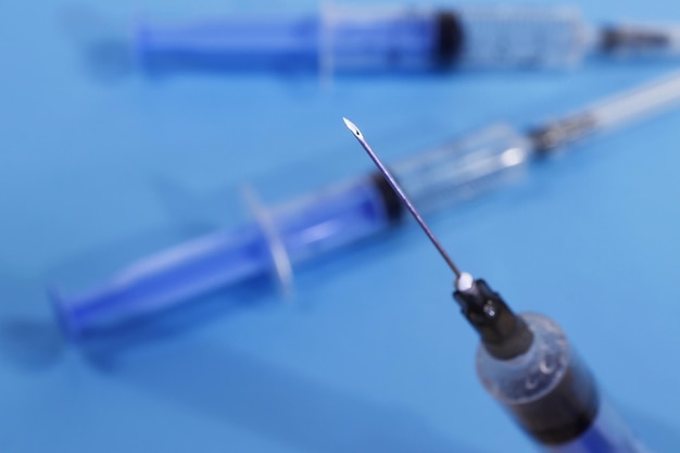 Photo medical syringes and needle closeup