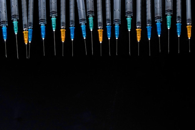 Medical Syringes with Needle on Black Background, Close up Syringe, Health care concept.