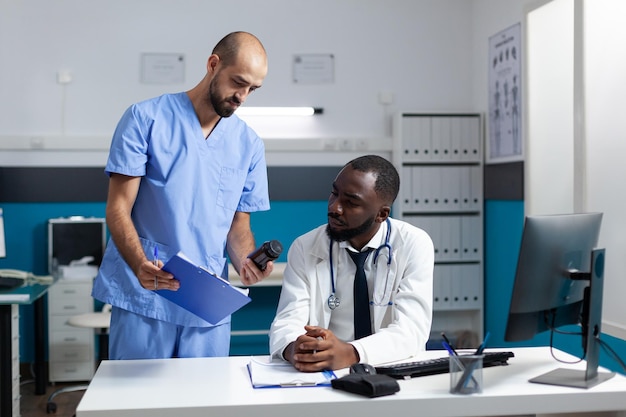 Medical team analyzing disease symptoms discussing healthcare treatment