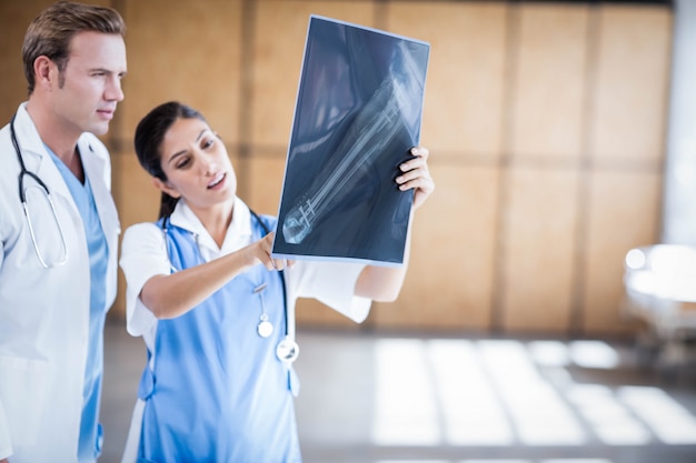 Medical team looking at x-ray together at hospital