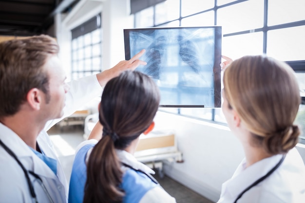 Medical team looking at x-ray together at hospital