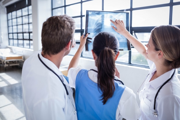 Medical team looking at x-ray together at hospital
