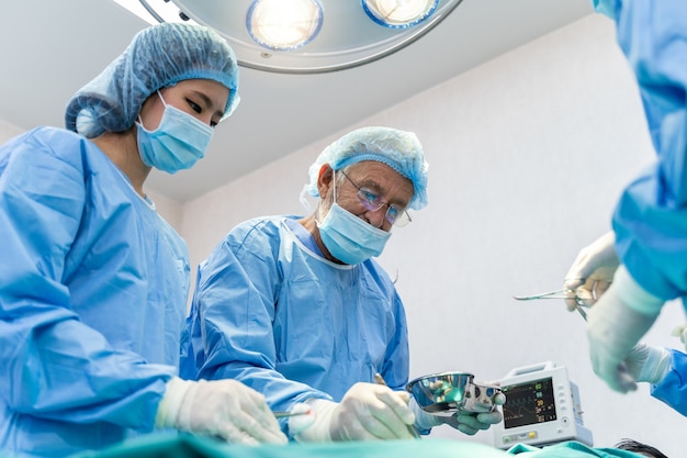 Medical Team Performing Surgical Operation in hospital operating