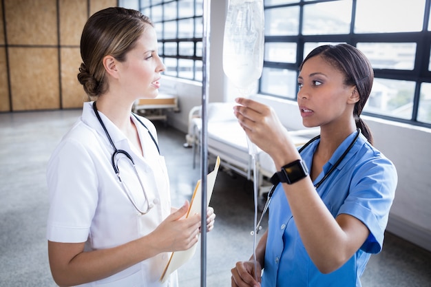 Medical team preparing an IV drip at the hospital