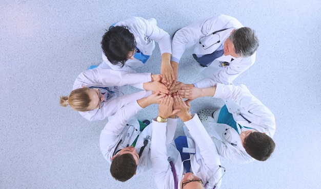 Medical team sitting and discussing at table top view