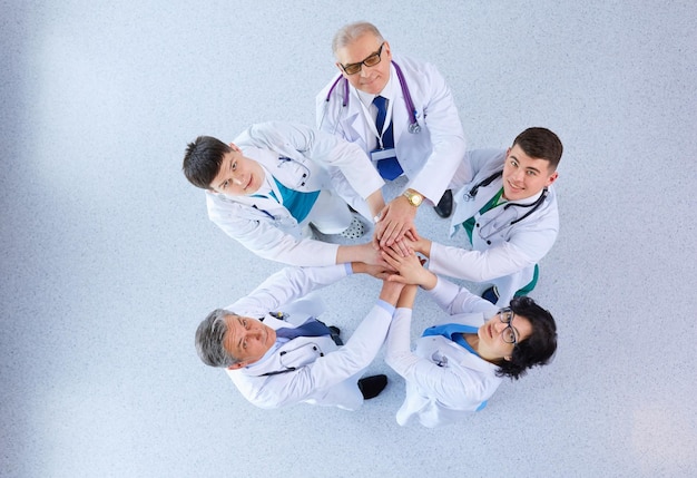 Medical team sitting and discussing at table top view