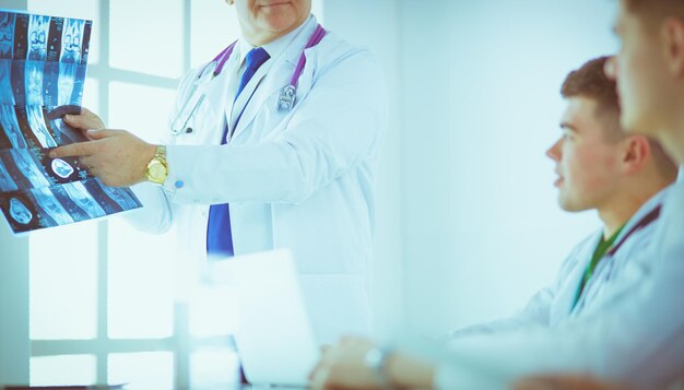 Medical team sitting and discussing at table