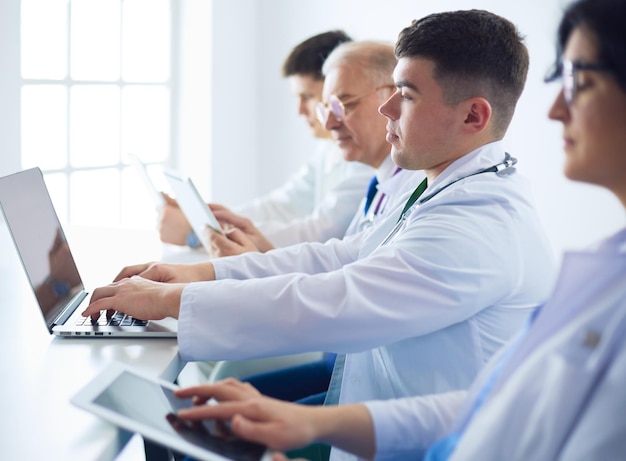 Medical team sitting and discussing at table