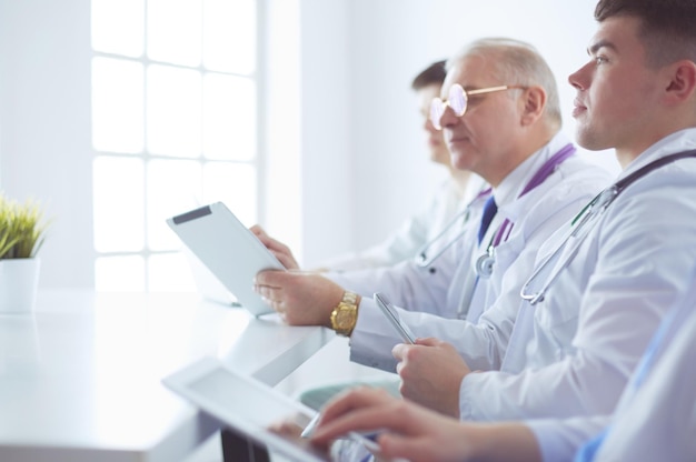 Medical team sitting and discussing at table