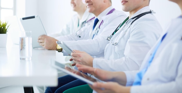 Medical team sitting and discussing at table