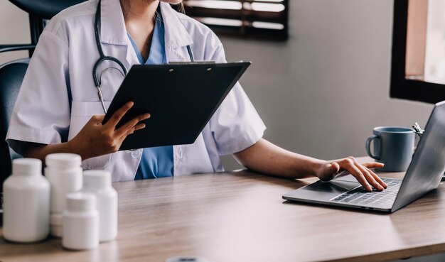 Medical technology concept Doctor working with mobile phone and stethoscope in modern office