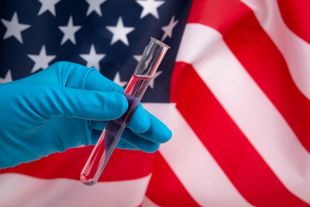 Medical test tubes on american flag. Virus and and healthcare concept.