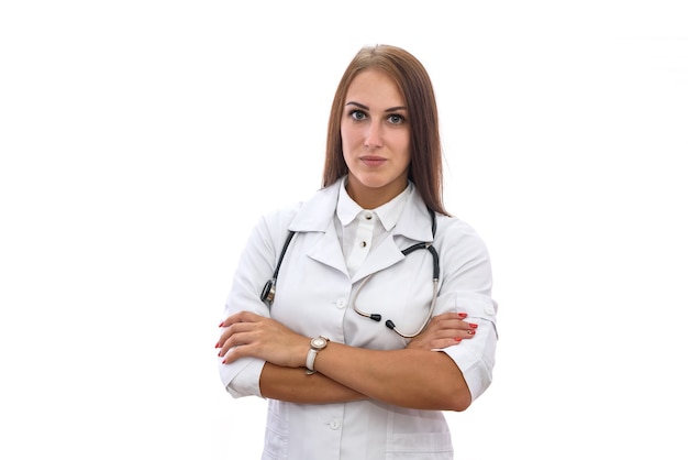 Medical worker. Beautiful woman in medical coat posing isolated on white background