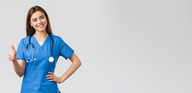 Medical workers healthcare covid and vaccination concept attractive cheerful female nurse doctor in